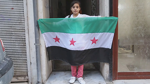 Syria War Documentary Film Subject Nasma Holding A Flag