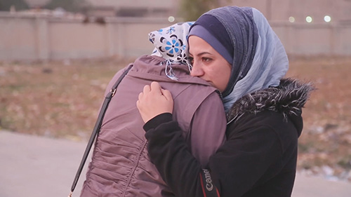 Syria War Documentary Film Subject Nour Crying With Her Friend